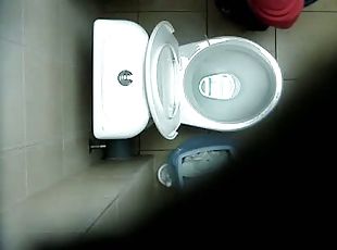 Pissing video of a blonde chick hovering her ass above the toilet